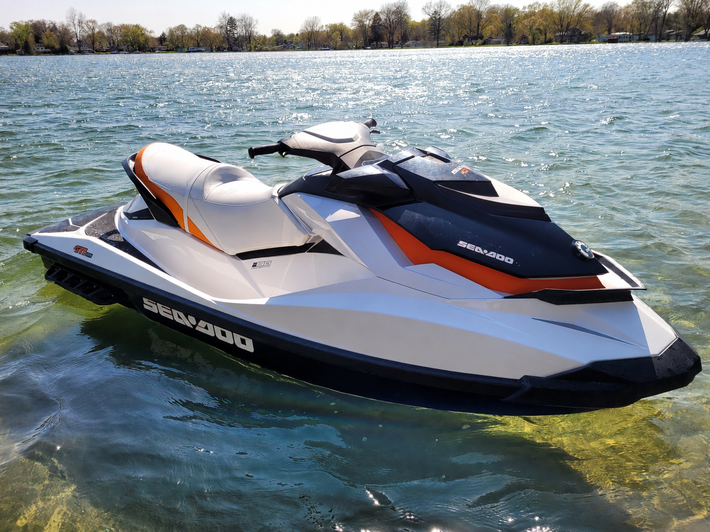 Sea-Doo GTI 130 floating on the clear, sandy-bottom water of Big Twin Lake